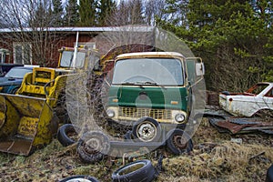 Scrapyard for cars (green truck)