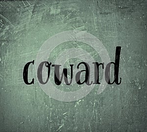 scratch and grunge background the word coward in black color photo