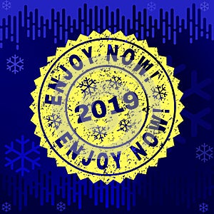 Scratched ENJOY NOW! Stamp Seal on Winter Background