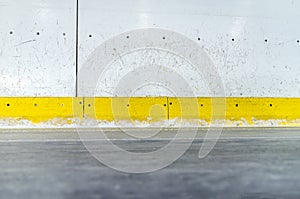 Scratched ice hockey rink boards