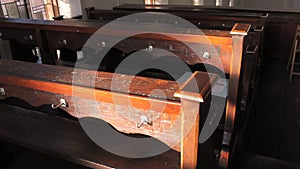 Scratched inscriptions on wooden church benches in the church