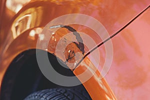 Scratching on the front of the car`s wing