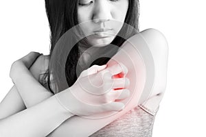 Scratching her arm or shoulder in a woman isolated on white background. Clipping path on white background.