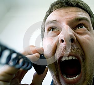 Scream of angry stressed man at phone