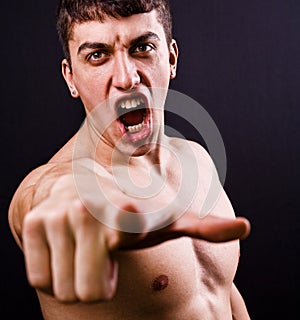 Scream of furious angry violent man photo