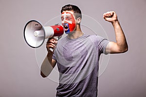 Scream on megaphone Slovak football fan in game supporting of Slovakia national team