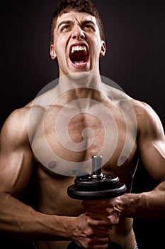 Scream of powerful muscular bodybuilder