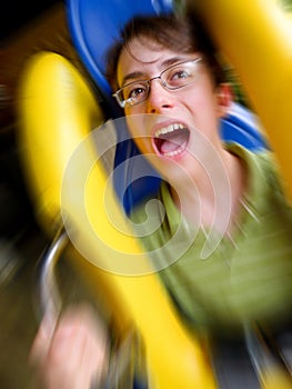 Screaming Boy Riding on a Roller Coaster photo