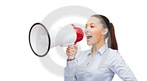 Screaming businesswoman with megaphone