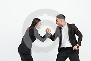 Screaming colleagues business team shaking hands.