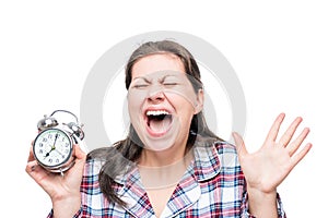 Screaming crazy woman with an alarm clock in her hands