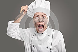 Screaming dirty chef threatening with knife