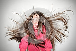 Screaming furious aggressive brunette woman