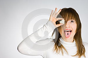 Screaming girl holding heart-shaped candy