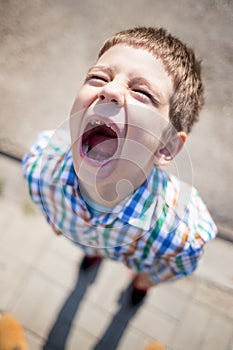 Screaming kid with caries and a missing tooth