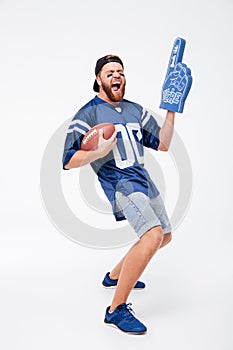 Screaming man fan in blue t-shirt standing isolated