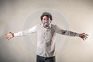 Screaming man with opened arms