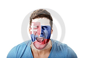 Screaming man with Slovakia flag on face.