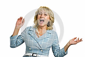 Screaming mature woman on white background.
