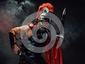 Screaming and savage roman warrior with swords and armour