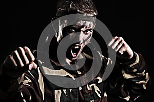 Screaming soldier wants to fight with enemy photo