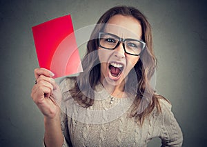 Screaming woman with red card