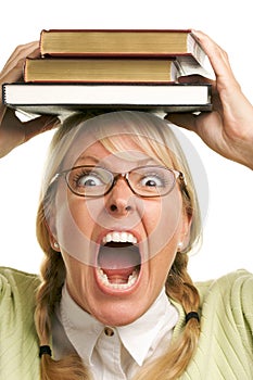 Screaming Woman Under Stack of Books on Head photo