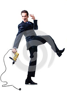 Screaming young businessman holding drill
