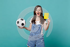 Screaming young woman football fan support team with soccer ball, yellow card, propose player retire from field isolated