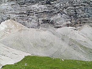 Scree slopes at rock wall photo