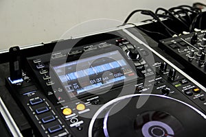 Screen and buttons of a DJ controller