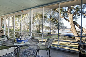 Screen porch with waterfront view