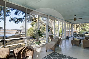 Screen porch with waterfront view photo