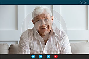 Screen view happy middle aged elderly man communicating online.