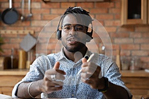 Screen view happy young african man holding video call conversation.