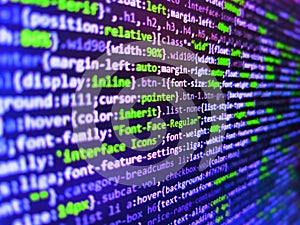 Screen of web developing code on dark background. Abstract source code background. Digital technology on display. Programming code