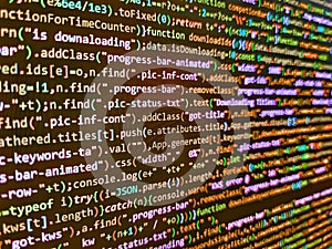 Screen of web developing code on dark background. Internet app development and design. Computer language script code screen.