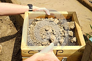 Screening soil for diamonds