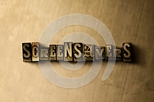 SCREENSAVERS - close-up of grungy vintage typeset word on metal backdrop