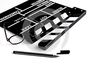 Screenwriter desktop with movie clapper board white background