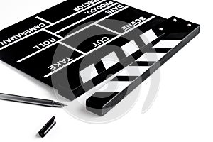 Screenwriter desktop with movie clapper board white background