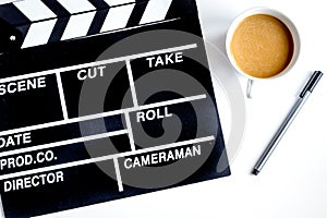 Screenwriter desktop with movie clapper board white background t