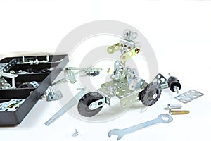 Screw driver, nuts, wrench, bolts and parts of children`s metallic constructor. children`s metal kit