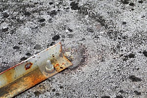 nut rusted sticking iron plate on concrete floor select focus with shallow depth of field