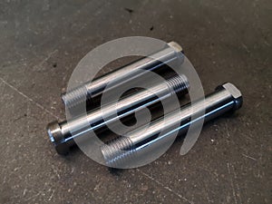 Screw Stud bolt. Stud steel shaft part manufacturing by CNC machining process.