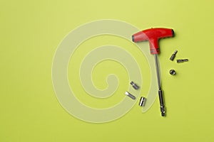 Screwdriver bit set on color background, top view