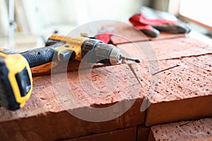 Screwdriver lies bricks, construction and repair