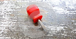 screwdriver on an old painted wod background