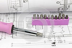 Screwdriver and set of bits on the blueprint