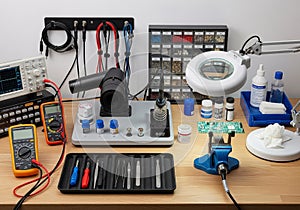 Screwdrivers, tweezers, and precision tools are neatly arranged